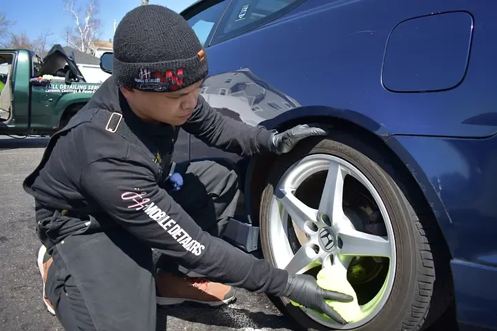 Hand cleaning an alloy wheel
